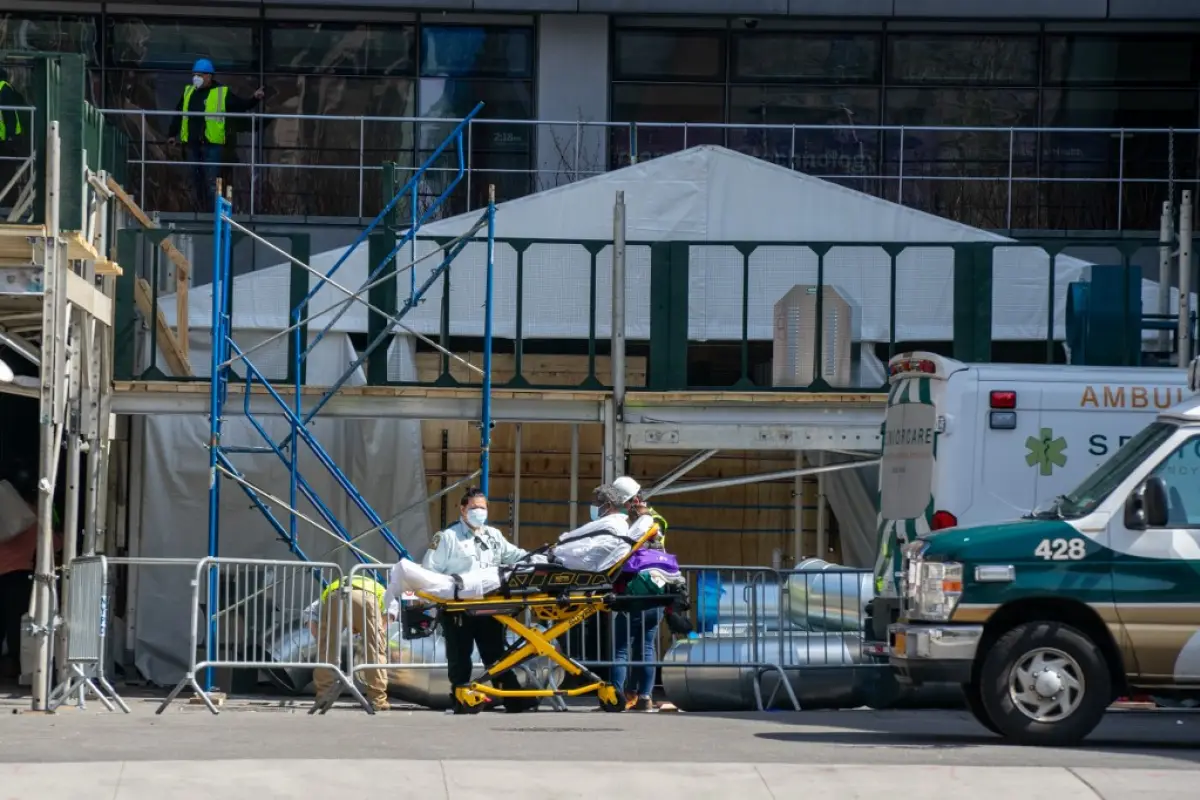 NEW YORK, NY - APRIL 7: A person is escorted into the emergency room at NYU Langone Hospital on April 7, 2020 in New York City, New York. Gov. Andrew M. Cuomo said on Tuesday in his daily briefing that 731 people had died since the prior day of the virus,