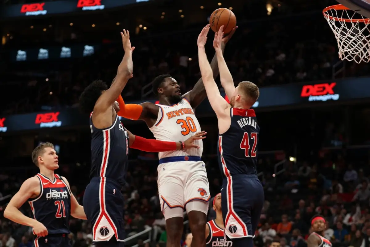 WASHINGTON, DC - MARCH 10: Julius Randle #30 of the New York Knicks shoots on Davis Bertans #42 of the Washington Wizards during the first half at Capital One Arena on March 10, 2020 in Washington, DC. NOTE TO USER: User expressly acknowledges and agrees 