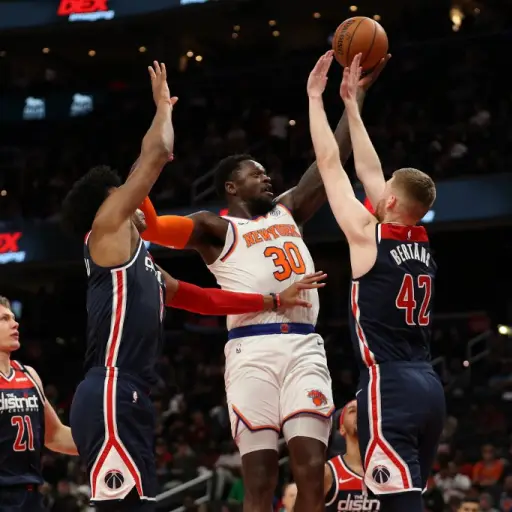 WASHINGTON, DC - MARCH 10: Julius Randle #30 of the New York Knicks shoots on Davis Bertans #42 of the Washington Wizards during the first half at Capital One Arena on March 10, 2020 in Washington, DC. NOTE TO USER: User expressly acknowledges and agrees 