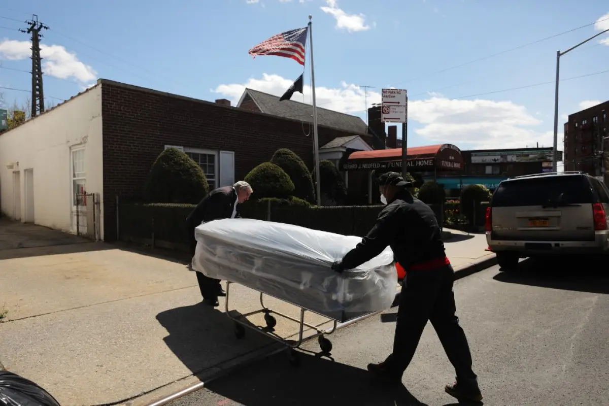 NEW YORK, NEW YORK - APRIL 22: Caskets are delivered to the Gerard Neufeld funeral home in Queens on April 22, 2020 in New York City. The decades old funeral home, that now primarily serves an immigrant community in Queens that has been hit hard by corona