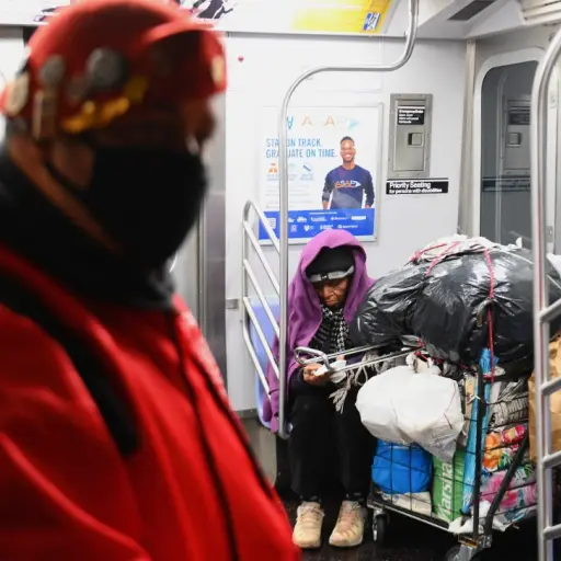 Jose Niejiaz of Guardian Angels delivers food and essentials to people in need in the subway on April 29, 2020 in New York City. - New York Citys homeless have sought refuge in the subways to escape the coronavirus pandemic, causing subway workers to ask