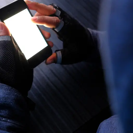 young hacker with smart phone stealing information- data security theft idea ,