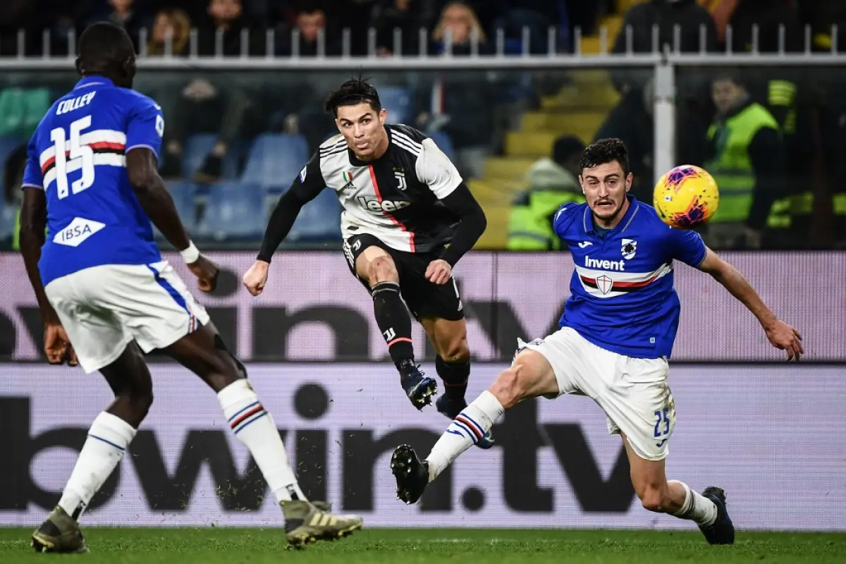 (From L) Sampdoria's Gambian defender Omar Colley, Juventus' Portuguese forward Cristiano Ronaldo and Sampdoria's Italian defender Alex Ferrari go for the ball during the Italian Serie A football match Sampdoria vs Juventus on December 18, 2019 at the Lui