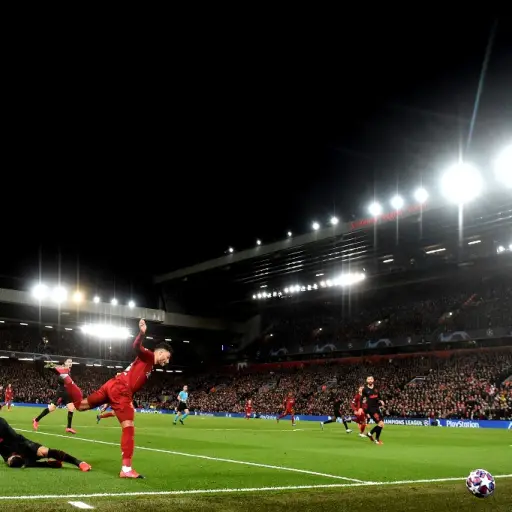 Liverpool's English midfielder Alex Oxlade-Chamberlain (2L) controls the ball during the UEFA Champions league Round of 16 second leg football match between Liverpool and Atletico Madrid at Anfield in Liverpool, north west England on March 11, 2020. (Phot