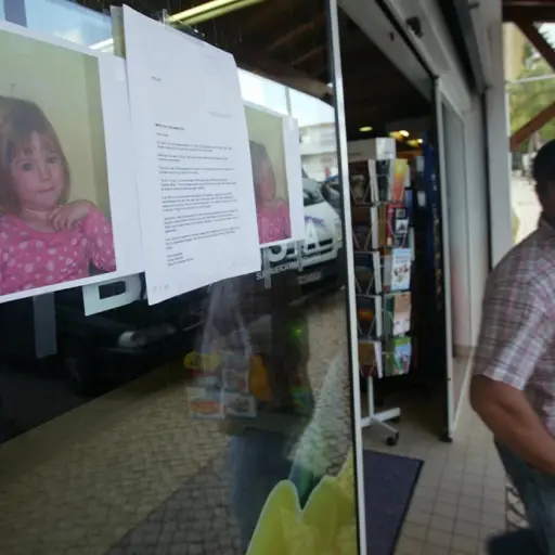 (FILES) In this file photo taken on May 4, 2007, photographs of missing 3-year old British girl Madelaine McCann are pasted onto a shop front 04 May 2007 in the area of the Ocean Club appartement hotel in Praia de Luz in Lagos. - German police said on Jun