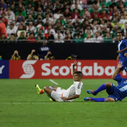 Mexico National Team's Francisco Rodríguez (L) and Guatemala National Team 's Brandon De Leon (R) collide during their CONCACAF Gold Cup soccer game at University of Phoenix Stadium July 12, 2015 in Glendale, Arizona. AFP PHOTO/JAROD OPPERMAN (Photo by JA