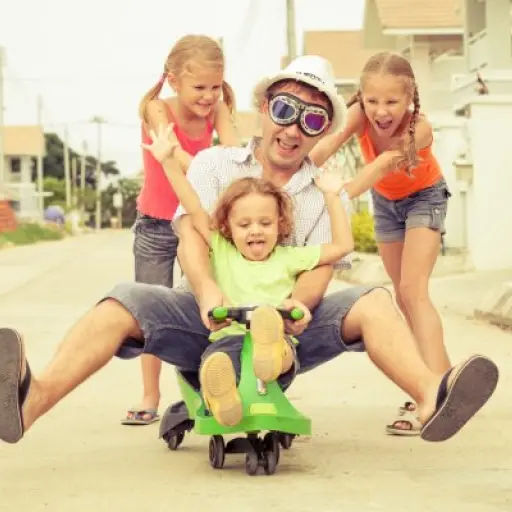 depositphotos_53500629-stock-photo-father-and-children-playing-near ,