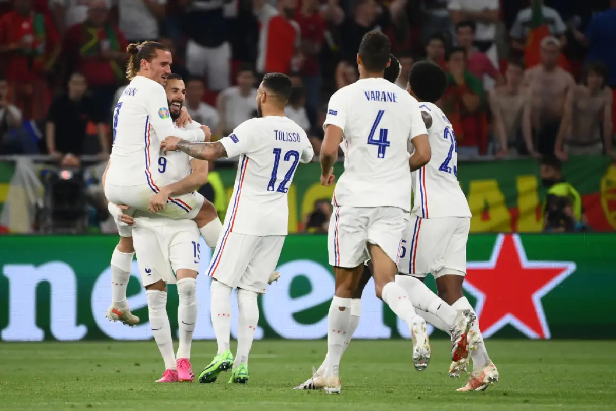 BUDAPEST, HUNGARY - JUNE 23: Karim Benzema of France celebrates with teammate Antoine Griezmann and Corentin Tolisso after scoring their side's second goal during the UEFA Euro 2020 Championship Group F match between Portugal and France at Puskas Arena on