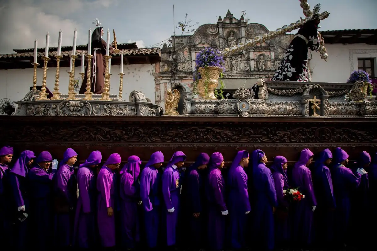 This picture was taken during Guatemala's custom during Catholic's main festivity, The Holy Week. These men are called &quot;Cucuruchos&quot;, they dress in purple in order to celebrate Christ's death and resurrection. I liked the way their bodies and faces showed 