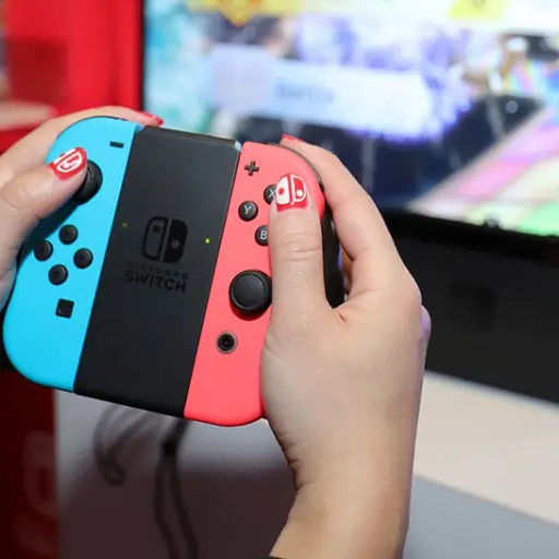 NEW YORK, NY - JANUARY 13:  Nintendo of America, A guest enjoys playing Mario Kart 8 Deluxe on the groundbreaking new Nintendo Switch at a special preview event in New York on Jan. 13, 2017. Launching in March 3, 2017,  Nintendo Switch combines the power 