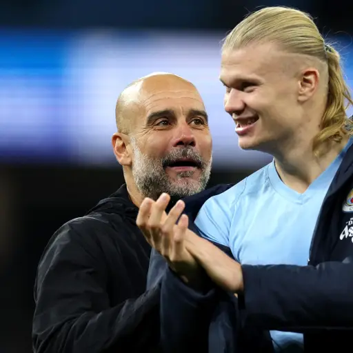 Pep Guardiola y Erling Haaland - EFE